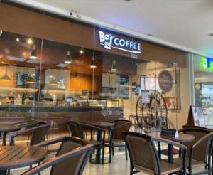 a restaurant with tables and chairs and a bar at 2313 Sun Vida Tower in Cebu City