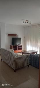 Łóżko lub łóżka w pokoju w obiekcie Apartamento Hacienda San Manuel