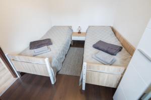 En eller flere senger på et rom på Apartman Mihelčić