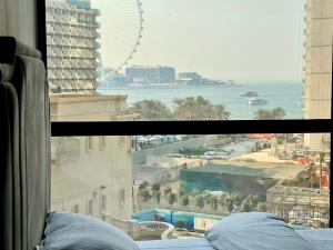 a view of the ocean from a hotel window at Leen Homes-JBR -Spacious 4 Bedroom apartment in Dubai