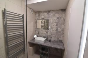 Kúpeľňa v ubytovaní Zsolna Apartman