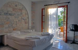 Posteľ alebo postele v izbe v ubytovaní Naxos Summerland resort