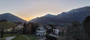 a group of houses in a valley with mountains at Bellavista - Residence in Barzio center near free ski shuttle in Barzio