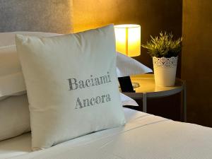 Cama ou camas em um quarto em B&B Baciami Ancora