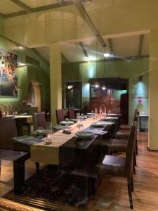 a long dining room with a long table and chairs at Sala Boutique Hotel in Male City