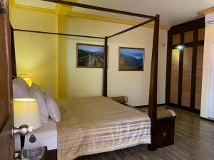 a bedroom with a canopy bed in a room at Sala Boutique Hotel in Male City