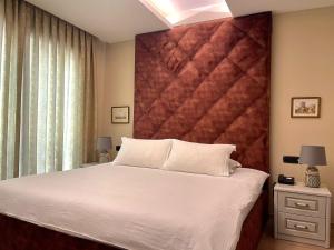 Postel nebo postele na pokoji v ubytování Vila Shard Boutique Hotel