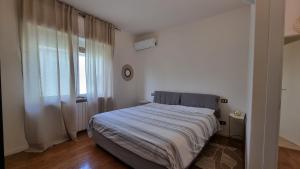 Postel nebo postele na pokoji v ubytování Suite Dalmine