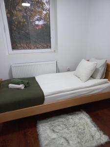Un pat sau paturi într-o cameră la Vila Banda