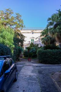 a car parked in front of a building at Casa Antica Pizzofalcone in Naples