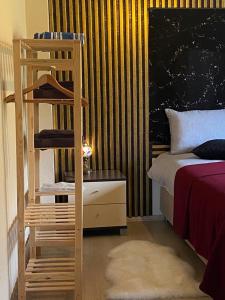 a bedroom with a bed and a ladder next to a bed at Shark SeaView Villa in Şarköy