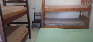 Postel nebo postele na pokoji v ubytování Ótima casa com piscina em Praia Grande + 43 fotografií