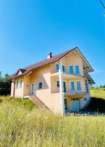 a house sitting on top of a hill at Villa Tesla S in Velika Kladuša