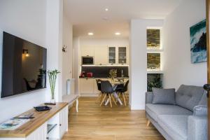 Μια τηλεόραση ή/και κέντρο ψυχαγωγίας στο Apartamentos Las Alas