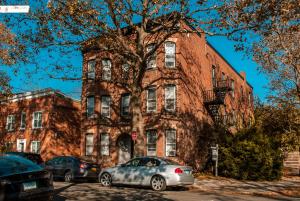 an old brick building with cars parked in front of it at Gorgeous 1BR Wooster Sq. apt. - wshr/dryr, parking in New Haven