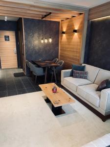 Posezení v ubytování Woodside Apartman Kopaonik 315