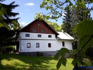 a large white barn with a red roof at Chachata - Jeseníky - polosamota in Dolní Moravice