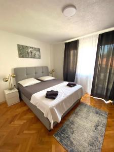 Postel nebo postele na pokoji v ubytování Apartments Graz