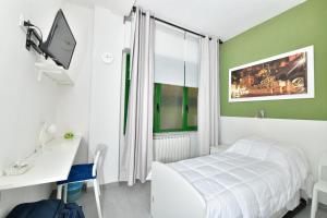 Säng eller sängar i ett rum på A San Lazzaro Rooms