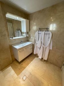 a bathroom with a sink and a mirror at Excellent 3 storey villa with a swimming pool in Belek