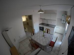 Kuchyň nebo kuchyňský kout v ubytování Depto. próximo al Centro y Rio San Antonio + 5 fotografií