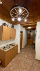 a kitchen with a sink and a ceiling at Guest House Alpha Ski Camp in Jahorina