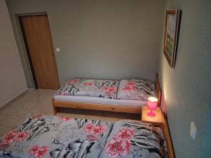 Postel nebo postele na pokoji v ubytování Penzion Kelčany u Kyjova