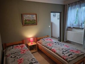 Postel nebo postele na pokoji v ubytování Penzion Kelčany u Kyjova