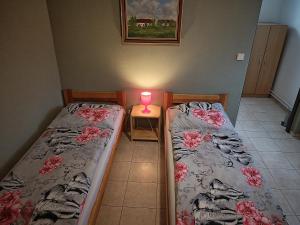 Postel nebo postele na pokoji v ubytování Penzion Kelčany u Kyjova