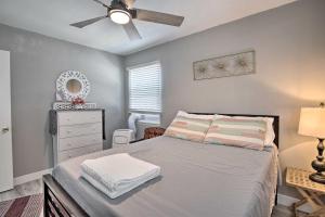 a bedroom with a bed and a ceiling fan at Contemporary 2 BR House w/ Yard, near Balboa & Downtown in National City