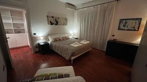A bed or beds in a room at FG St Peter's Suites
