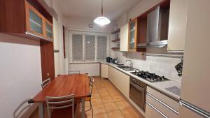 A kitchen or kitchenette at FG St Peter's Suites