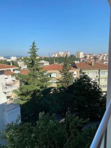a view of a city with trees and buildings at Etilerde metroya yakın sakin sessiz ve ferah daire in Istanbul