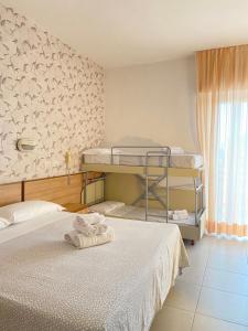 Postel nebo postele na pokoji v ubytování Hotel Ravello Adults Only + 37 fotografií