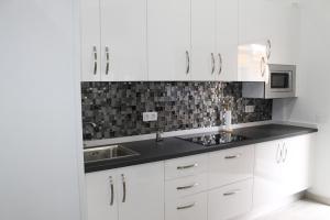 Kuchyňa alebo kuchynka v ubytovaní Apartamentos los Nidillos
