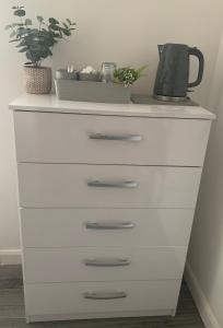 a white dresser with a blender on top of it at BYRON SQUARE COTTAGE in Hucknall