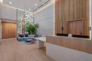 a lobby with a reception desk and a living room at Amazing Condo in Downtown Miami/Brickell w/PARKING in Miami +53 photos