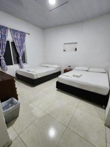 Voodi või voodid majutusasutuse Eco Hotel El Reposo toas