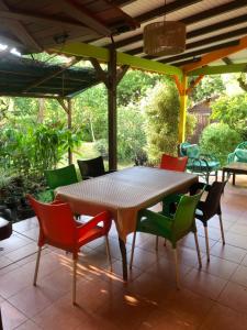 a table and chairs on a patio at Rêves de mer in Deshaies