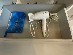 a nintendo wii game system in a box at Salt Garden Superior double rooms in Druskininkai