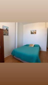 Cama ou camas em um quarto em Casa Barros Borgoño