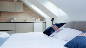 Łóżko lub łóżka w pokoju w obiekcie Hotel Rezydencja AS & Spa-Najwyżej w Karpaczu