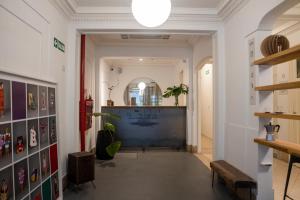 a hallway with a large screen in a building at Casa Franca Recoleta Hostel in Buenos Aires