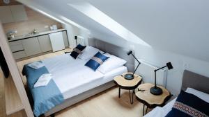 Łóżko lub łóżka w pokoju w obiekcie Hotel Rezydencja AS & Spa-Najwyżej w Karpaczu