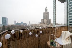 a balcony with a view of a city skyline at Apartments Centre by Arrenda in Warsaw