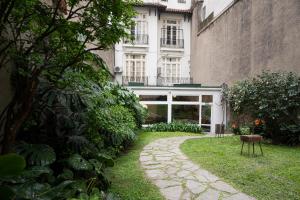 a walkway in front of a building at Casa Franca Recoleta Hostel in Buenos Aires