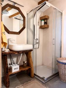 a bathroom with a shower and a sink at DandyVillas-Vintage Cottage House-Pelion-Argalasti-Kallithea in KallithÃ©a