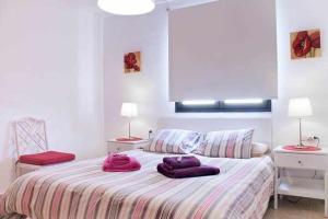 Tempat tidur dalam kamar di Enjoy Arrecife Center
