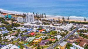 an aerial view of a city with a beach at SeascapeatAlexBeach Budget Accomodation in Alexandra Headland