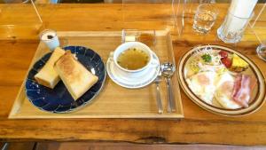 a tray with two plates of food and a bowl of soup at irodori in Matsumoto